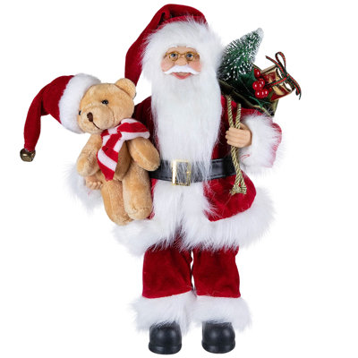 Figurine de père Noël avec sac-cadeau