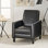 Fauteuil à dossier poussoir en cuir noir pour une décoration intérieure élégante