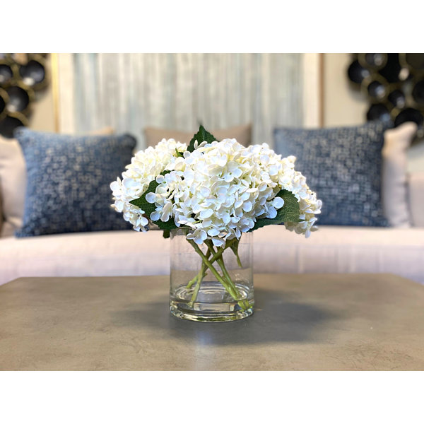 winter white artificial flowers arrangement in glass vase. Faux hydrangeas,  white peony and skimmia — Victoria James Floral Designs