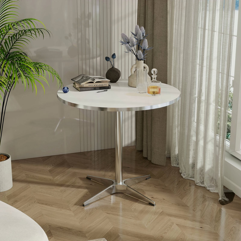 Petite table à manger ronde moderne de style minimaliste convenant à un salon de cuisine