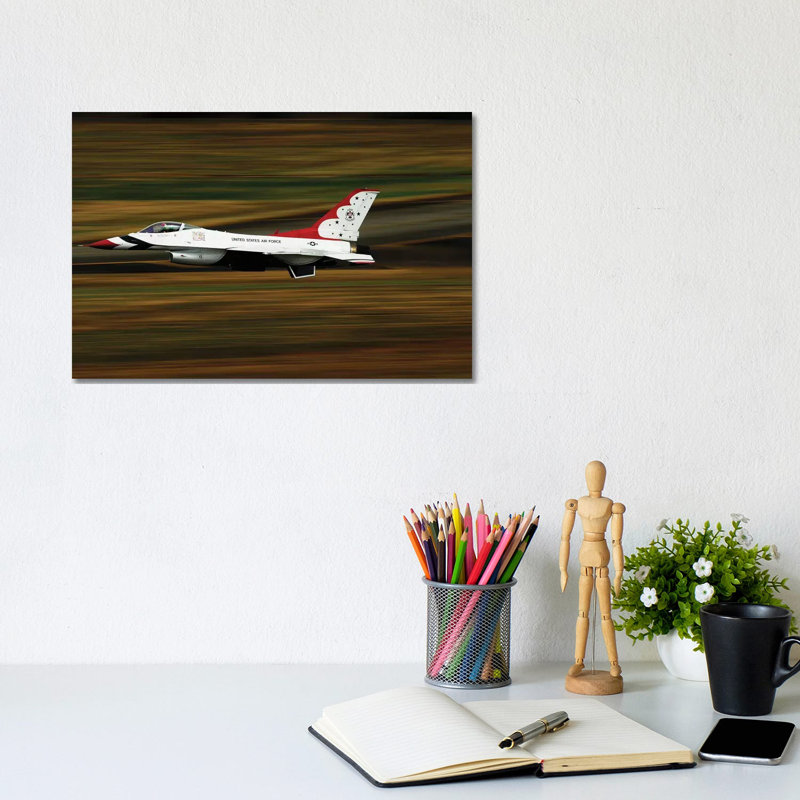 An F-16 Thunderbird Of The US Air Force Flying At High Speed by Stocktrek Images - Wrapped Canvas Print