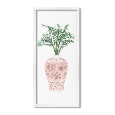 Palmier en feuilles dans un vase orné