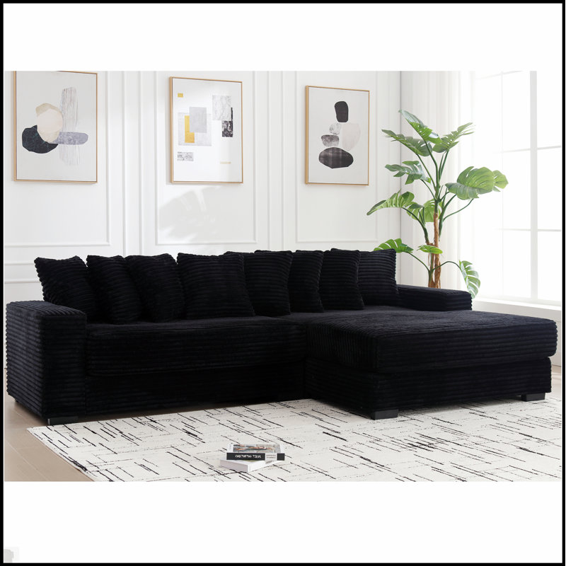 Canapé confortable surdimensionné en velours côtelé avec plusieurs coussins pour la détente et le style moderne