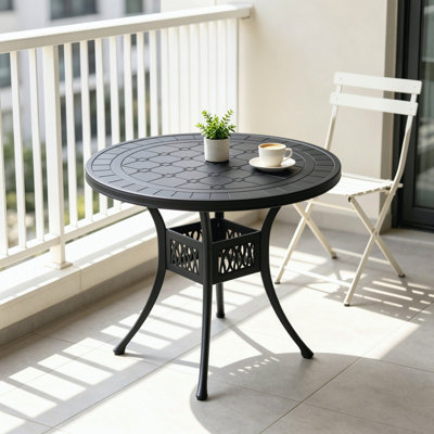 Table de salle à manger 39,37 pouces en fonte d'aluminium avec plateau sculpté et structure en métal noir
