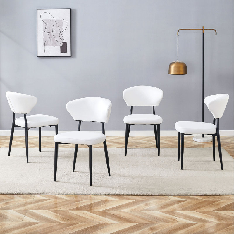 La chaise de salle à manger minimaliste et ergonomique, avec un dossier incurvé pour une conception confortable, libère une nouvelle position assise confortable et minimaliste. Un paquet de 4