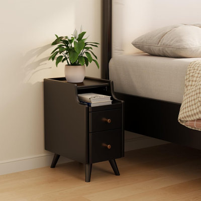 A Small Bedside Table With Drawers