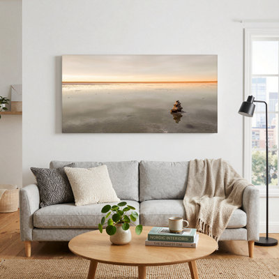 Stacked Stones Reflected in Calm Water at Sunset Canvas Wall Art