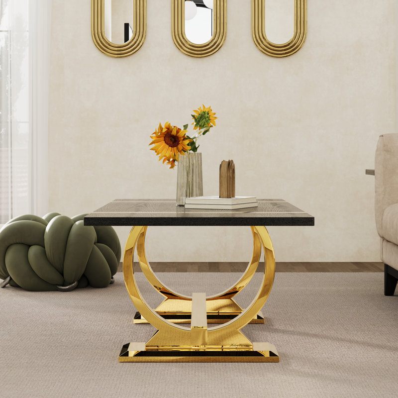 Table basse de 50 pouces noire et dorée avec base en U en acier inoxydable poli