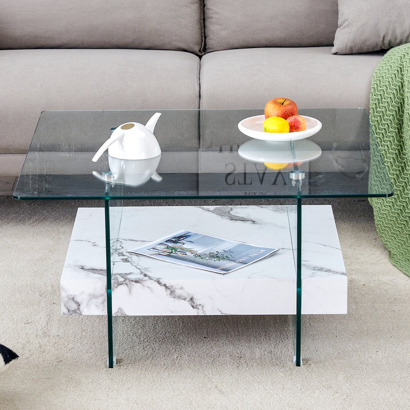 Table basse carrée 31,4 pouces à deux niveaux - une combinaison élégante de verre transparent et d'autocollant en marbre. Elle peut être utilisée comme table basse, table d'appoint ou présentoir.