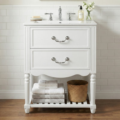 Meuble-lavabo de 24 po avec lavabo en céramique, deux tiroirs à fermeture en douceur et tablette ouverte, design à vagues rétro, style rétro élégant