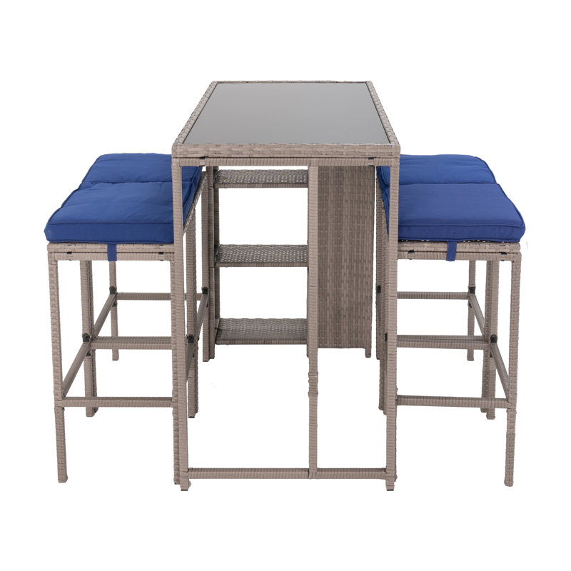 Aldonna 4 - Person Wicker Patio Dining Set with Rectangular Table , Cushions Included, Blue, Light Gray