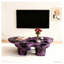 Table basse moderne en faux travertin texturé avec forme de papillon en mauve et noir