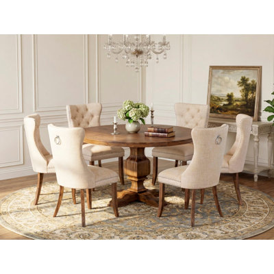 Ensemble de table de cuisine 7 pièces en lin 6 chaises rembourrées beiges claires, dossier capitonné et une table de cuisine ronde de 54 po au fini noyer antique.