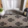 Arneshia Damask Sand/Black Area Rug