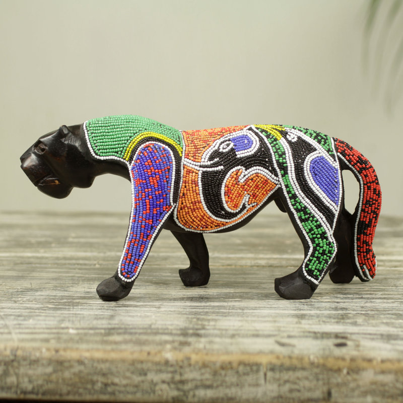 Figurine panthère avec éléphant et oiseau