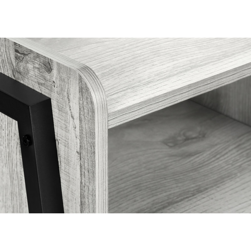 Table d'appoint robuste en gris avec pieds en métal noir pour une utilisation moderne et polyvalente