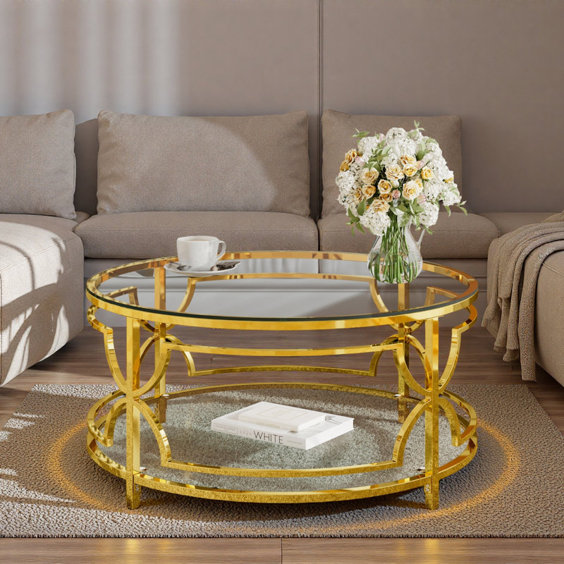 Table basse ronde avec plateau en verre trempé, structure en métal géométrique et tablette inférieure, Transparent