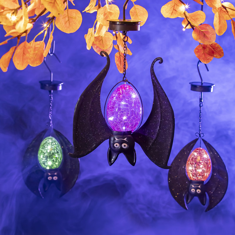 Batte d'Halloween à suspendre solaire Hildra, orange et vert