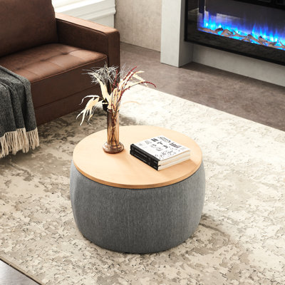 Rangement rond gris foncé - 2 en 1. Agit comme table de bout et siège. Fait à la main. Revêtement en lin. 25,5 po x 25,5 po x 14,5 po. Capacité de 250 lb 1. Fabriqué à la main avec du lin. Supporte 250 lb. Aucun assemblage requis