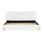 Lit tapissier blanc moelleux avec tête de lit ondulée et coutures verticales, très grand