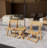 A foldable small outdoor leisure table and chair set with excellent materials includes 2 chairs and a rectangular table.
