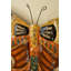 Horloge murale papillon en métal