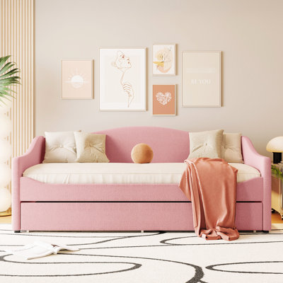 Lit de jour simple tapissier rose avec lit gigogne et élément décoratif attrayant