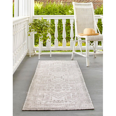 Tapis intérieur / extérieur naturel Arletha Southwestern