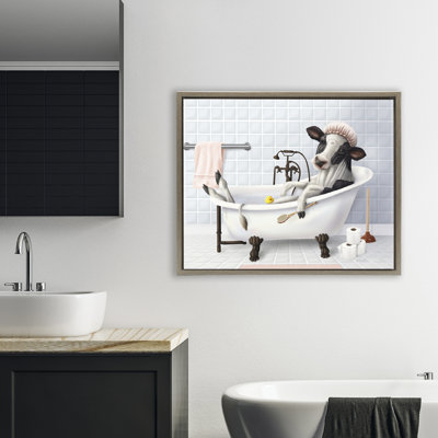 Vache et canard en caoutchouc dans un cadre flottant de bain, design par Mehu Art