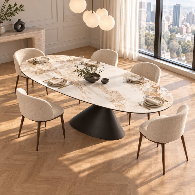 Table de salle à manger ovale moderne en pierre frittée avec dessus d'aspect marbre et pied central en acier inoxydable, idéale pour la cuisine et le salon.