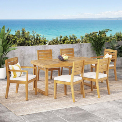 Ensemble repas d'extérieur en bois d'acacia avec coussins 7 pièces