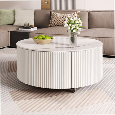 Table basse ronde moderne et fonctionnelle avec roulettes et deux tiroirs, idéale pour divers espaces de vie et décors
