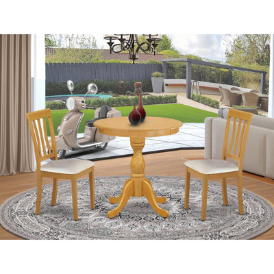 3 Piece Kitchen Table & Chairs Set Contains a Round Dining Room Table with Pedestal and 2 Faux Leather Upholstered Chairs, Oak