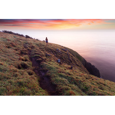 Girl Silhouetted At Sunrise by Charlie Blacker - Wrapped Canvas Print