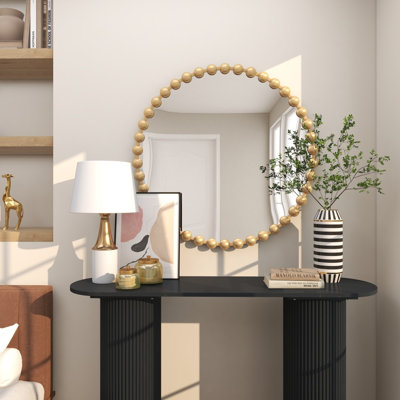Miroir mural en métal avec détails perlés