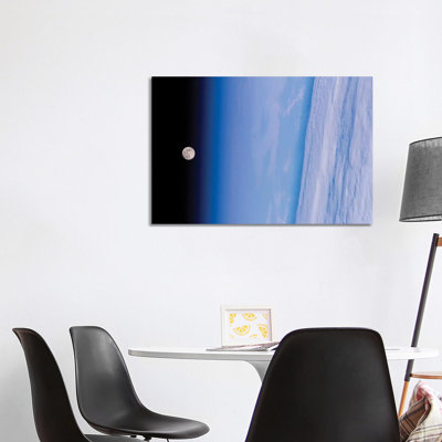A Full Moon Above Earth's Horizon And Airglow by Stocktrek Images - Wrapped Canvas Print
