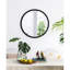 Le miroir mural de salon en métal à cadre perlé ajoute du style de chambre à coucher