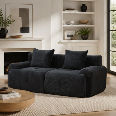 Causeuse modulaire capitonnée avec coussins