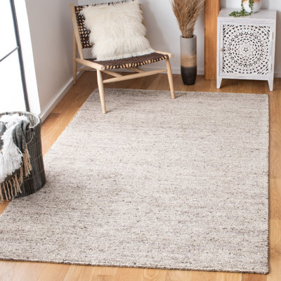 Fairlight Hand Tufted Viscose/Wool Solid Color Rug in Brown