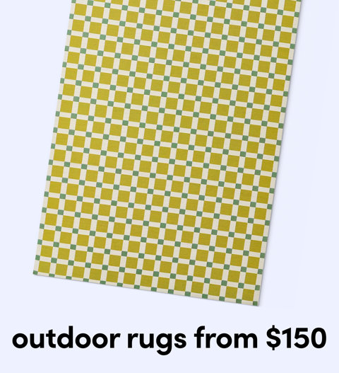 A close-up of an outdoor rug featuring a small yellow and green checkered grid pattern from $150.