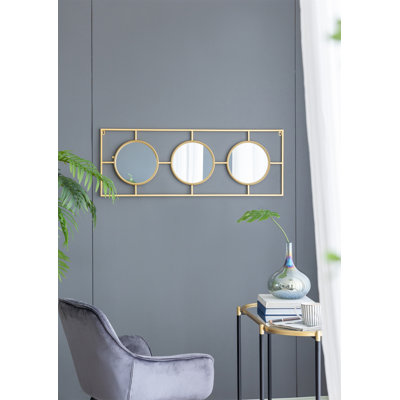 3 miroirs muraux dans un cadre rectangulaire