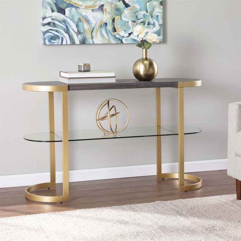 Contemporary Ebony Console Table with Clear Glass Shelf and Sleek Gold Metal Frame, Perfect for Entryways and Living Spaces.