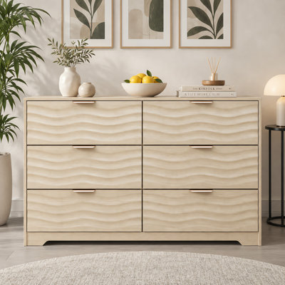 Commode Nidovia de 122 cm de large à 6 tiroirs, idéale pour la chambre et le salon, en bois naturel.