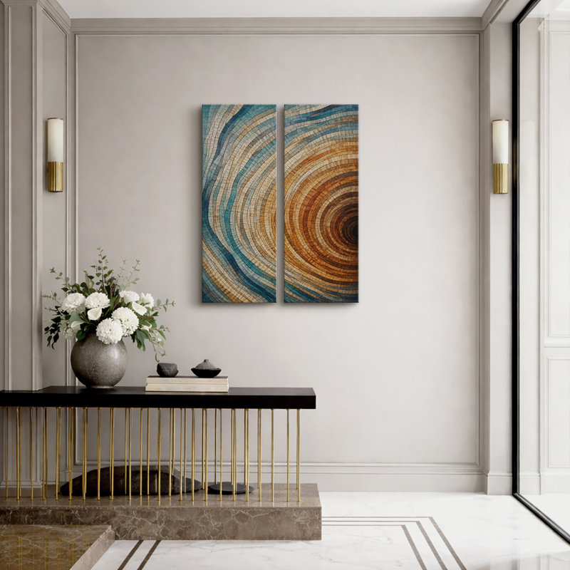 Ensemble de 2 tableaux encadrés sur toile, motif géométrique abstrait moderne à anneaux concentriques bleus et oranges (32 po x 12 po x 2 po).