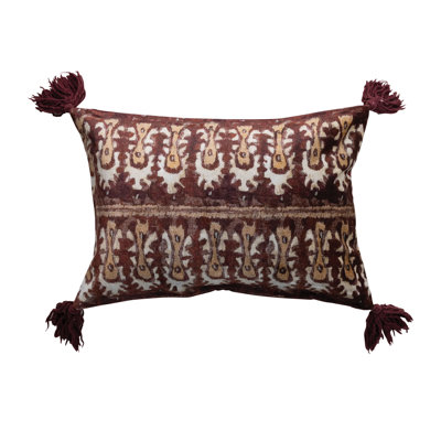 Coussin en velours de coton avec imprimé pompon Ikat