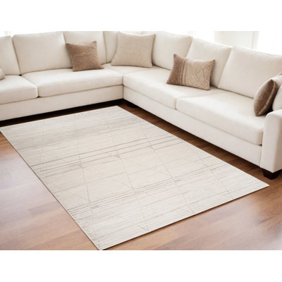 Tapis abstrait crème et beige 5 pi x 8 pi