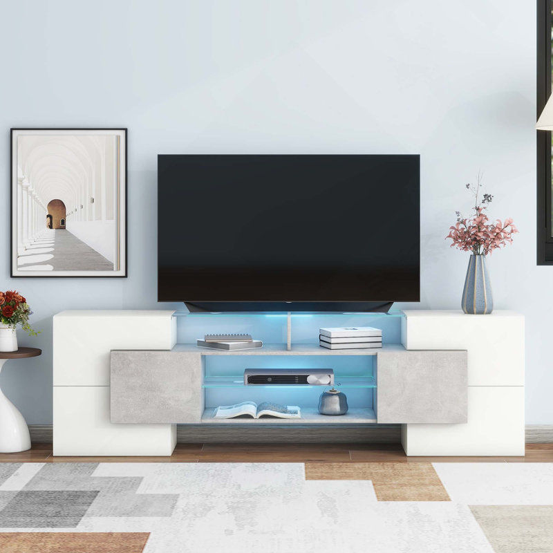 Meuble télé ultrabrillant de forme unique avec lumières DEL à changement de couleur et 2 tablettes en verre illuminées pour téléviseurs de 88 po ou moins
