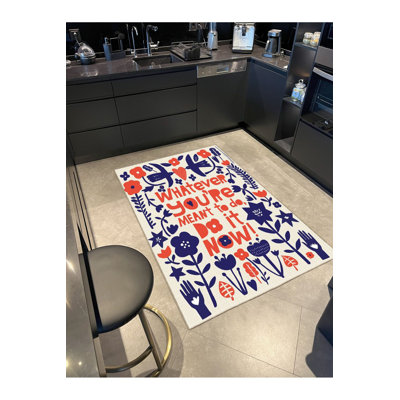 Tapis tissé à motif floral Text