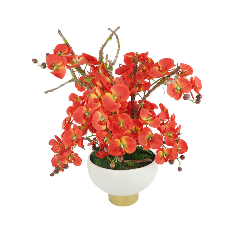 Arrangement de fausses orchidées modernes dans un vase en céramique