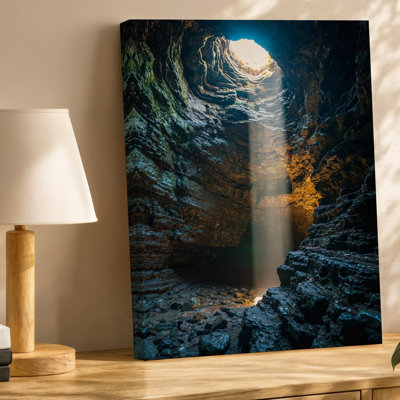 Canvas A Dramatic Underground Cave Scene Illuminated By A Single Beam Wall Art Of Light Cascading Down From A Circular Opening Above Canvas Wall Art